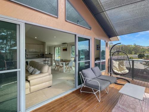 a living room with sliding glass doors at Beachside Retreat with Garage Parking in Surf Beach