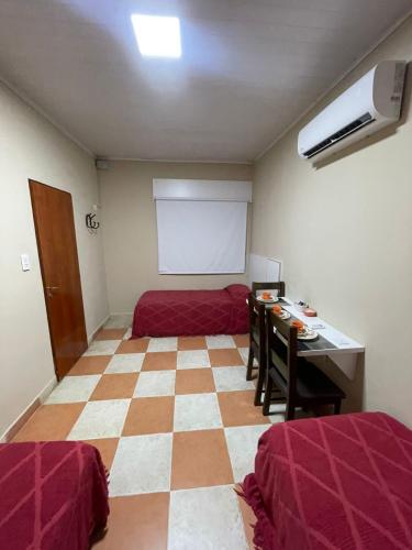 Ένα ή περισσότερα κρεβάτια σε δωμάτιο στο Hotel Don Luis