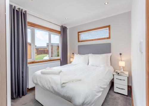 Katil atau katil-katil dalam bilik di Castlewood Lodges