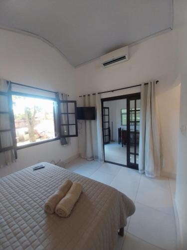 Ένα ή περισσότερα κρεβάτια σε δωμάτιο στο Verde Mar Inn