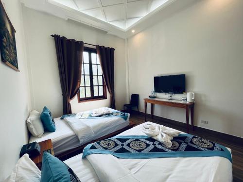 Cama o camas de una habitación en 若溪酒店 ruoxi hotel