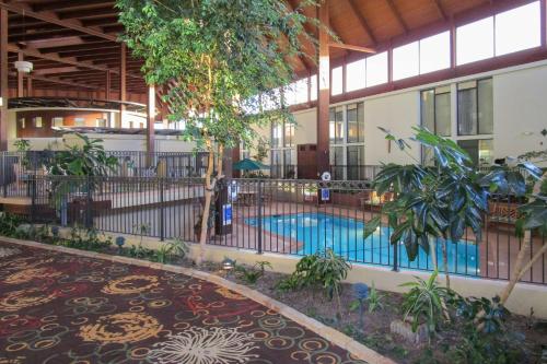 a pool in the middle of a building at Radisson Hotel Lenexa Overland Park in Lenexa