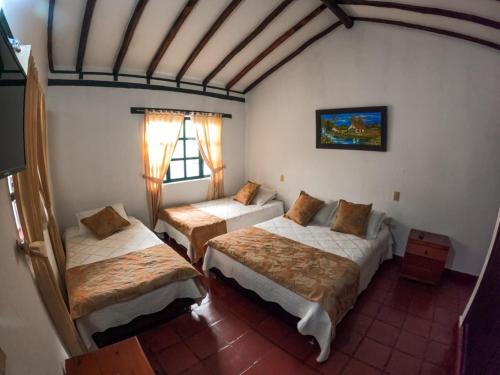 Una cama o camas en una habitación de Hostal casa de los sueños