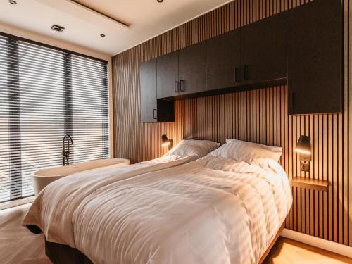 Ένα ή περισσότερα κρεβάτια σε δωμάτιο στο Modern holiday home in Kesteren