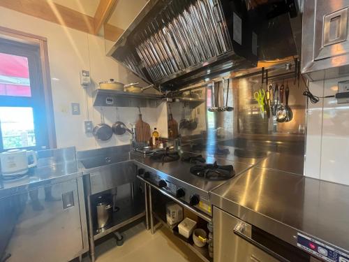 Kuchyň nebo kuchyňský kout v ubytování お休み処おおはま