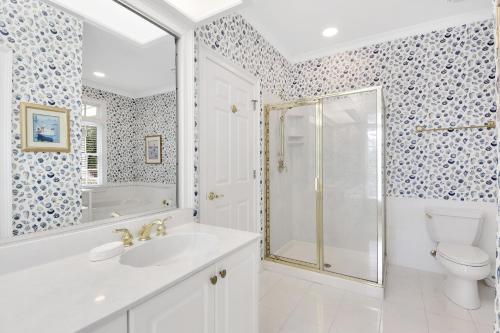 a bathroom with a shower and a sink and a toilet at MH3012: 3012 Marsh Haven in Seabrook Island