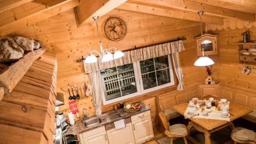 an overhead view of a kitchen in a log cabin at Almdorf im Winkl - Blockhüttendorf in Gröbming in Gröbming