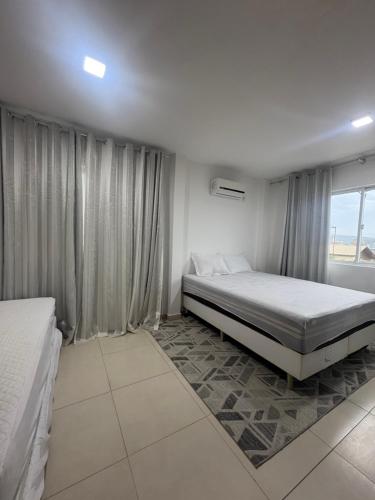 Llit o llits en una habitació de Duplex Quadra Mar
