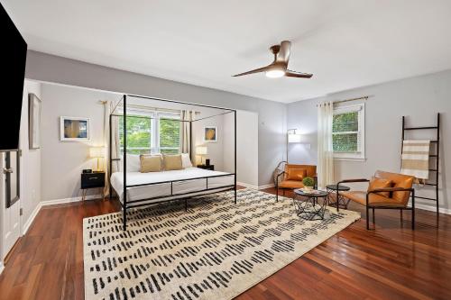 a bedroom with a bed and a living room at AV3-20: 3 20th Avenue in Isle of Palms