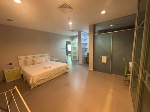 Ένα ή περισσότερα κρεβάτια σε δωμάτιο στο MCITI Suites