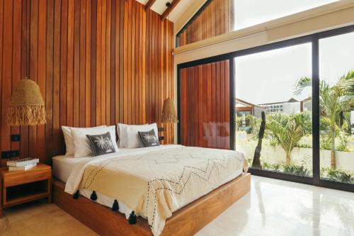 Ένα ή περισσότερα κρεβάτια σε δωμάτιο στο Batu Bingin Villa