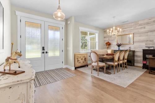 a kitchen and dining room with a table and chairs at Charming 3BR Waterfront Home - Private - Serene in Inverness