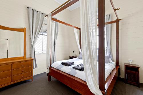 Ένα ή περισσότερα κρεβάτια σε δωμάτιο στο CBD Holiday Home