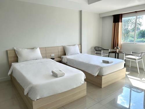 Postel nebo postele na pokoji v ubytování DD Boutique Resort