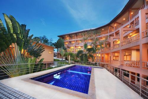 a hotel with a swimming pool in front of a building at Haad Yao Bayview in Koh Phangan