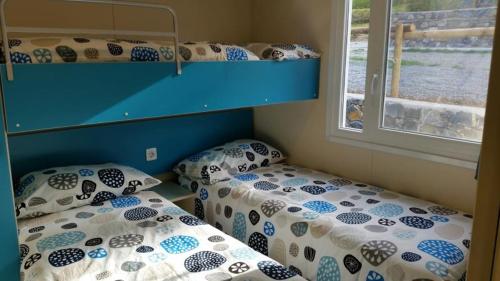 Katil atau katil-katil dalam bilik di Camping La Sfinge