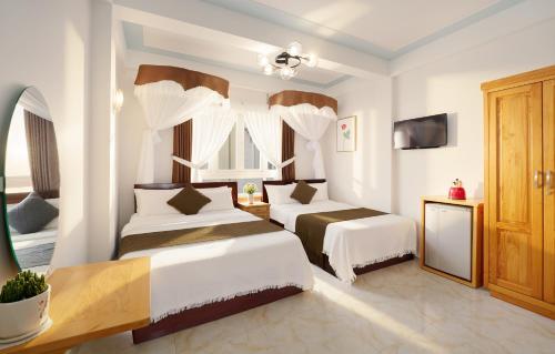Ένα ή περισσότερα κρεβάτια σε δωμάτιο στο Hanah Hotel Dalat