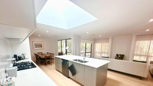 a large kitchen with a large skylight in the ceiling at Peppermint Breeze in Vasse