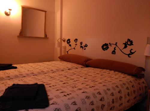 a bedroom with a bed with a comforter on it at Madrid Rent 6 in Madrid