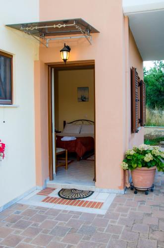 a door leading to a bedroom in a house at Nefeli in Levidhion
