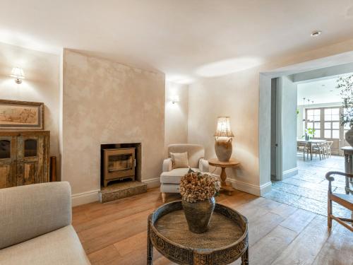 a living room with a couch and a fireplace at Chantry House in Shoreham-by-Sea