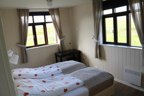 Letto o letti in una camera di Sólheimahjáleiga Guesthouse