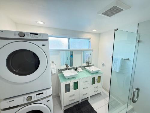 a washing machine in a bathroom with a shower at Hillside Hideaway - Private Woodland Hills Canyon Suite in Woodland Hills