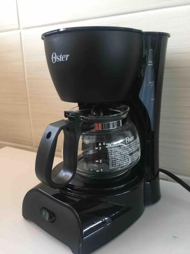 a coffee pot sitting on top of a coffeemaker at Suite La Lomita #1 Climatizada Zona Dorada Tuxtla in Tuxtla Gutiérrez