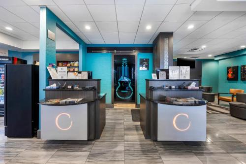 a lobby of a store with blue walls and counters at The Capitol Hotel Downtown, an Ascend Collection Hotel in Nashville