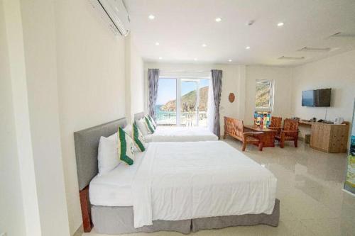 Postel nebo postele na pokoji v ubytování KyCo Peninsula Quy Nhon Resort