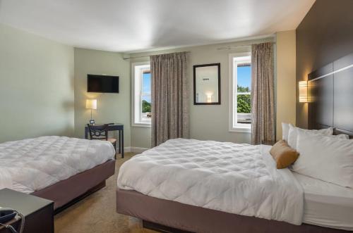 Ένα ή περισσότερα κρεβάτια σε δωμάτιο στο The Gin Hotel, an Ascend Collection Hotel