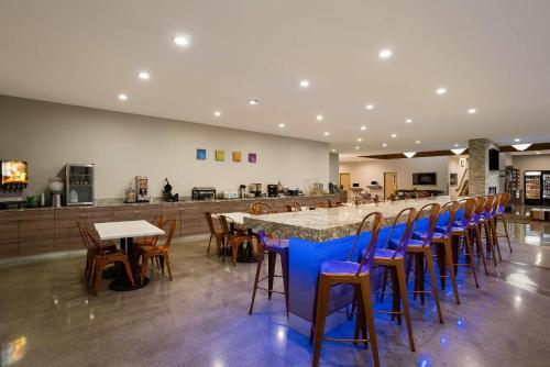 a large room with a long table and chairs at Richland Riverfront Hotel, an Ascend Collection Hotel in Richland