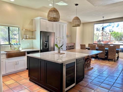 a kitchen with a large island in the middle at Casa Catalina - Luxury Desert Oasis in Tucson