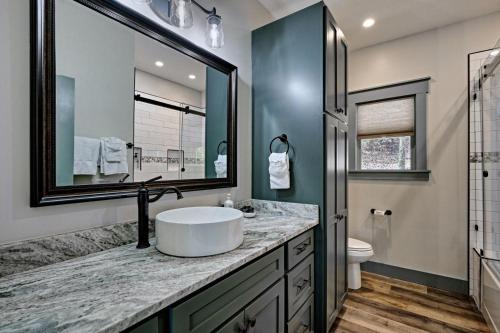 a bathroom with a sink and a mirror at The Owlery in Highlands