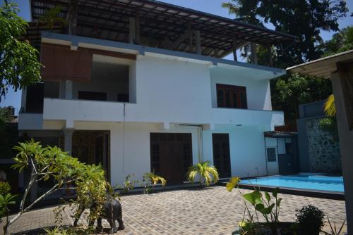a view of the house from the courtyard at New View Hikkaduwa in Hikkaduwa