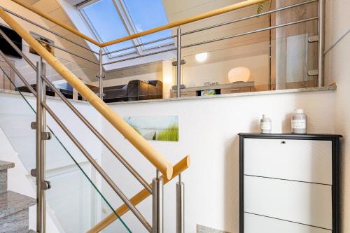 a staircase in a house with a glass ceiling at Ferienwohnung Luri in Gangelt