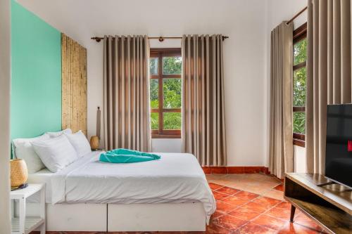A bed or beds in a room at Luxurious 7BR Villa in Mui Ne with Private Swimming Pool