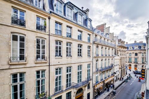 a view of a street in a city with buildings at WS Louvre - Casanova in Paris