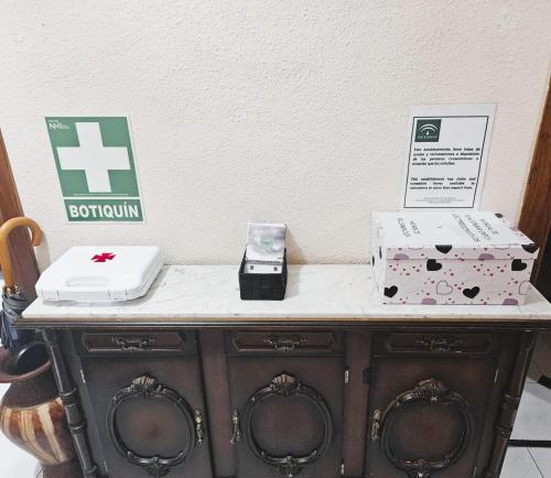 a table with two boxes on top of it at Casa de Pueblo con Encanto in Valderrubio