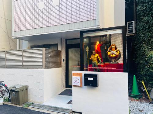 a store front with a window with mannequins in it at 桜の舞1号馆 Sakura Dance 1 in Osaka