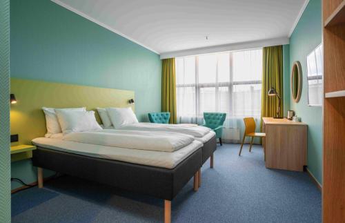 a bedroom with a large bed in a room at Thon Hotel Verdal in Verdal