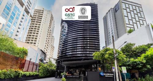 a building with a sign on the side of it at Best Western Sukhumvit 20 in Bangkok