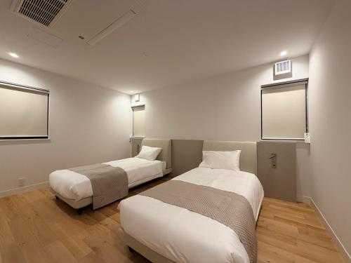 Postel nebo postele na pokoji v ubytování The Selora Miura