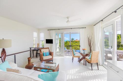 a living room with a couch and a table at Wyakha 2 Ocean View in Long Bay Hills