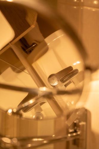 a close up of a glass table with a knife at Logis Hôtel Le Bellevue in Trévignin
