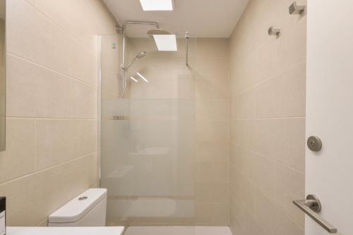 a bathroom with a shower and a toilet at Host Dalies in San Pedro de Premiá
