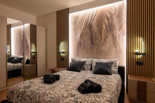 Ένα ή περισσότερα κρεβάτια σε δωμάτιο στο Elegant Urban Home - Free Parking - 7min Niguarda