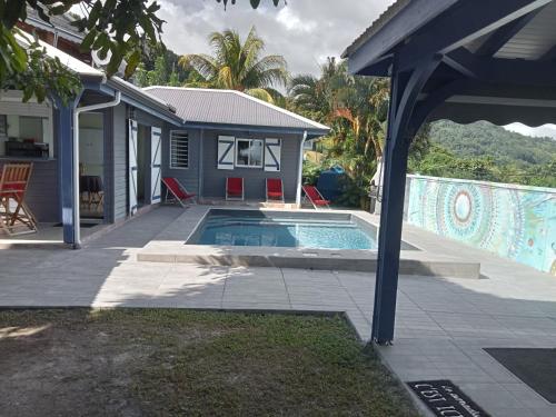 a house with a swimming pool in a yard at AWMONY'KAZ, Gite à Trois-Rivières GUADELOUPE in Trois-Rivières