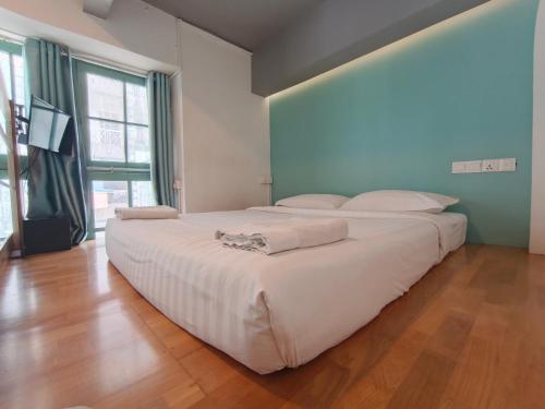 Llit o llits en una habitació de BaobaBed Lodge, Yangon