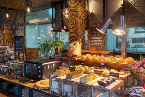 a bakery with a bunch of pastries on display at Keemala in Kamala Beach
